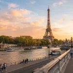 "Eiffel Tower at sunset with the Seine river in the foreground, one of the best places to visit in Europe"