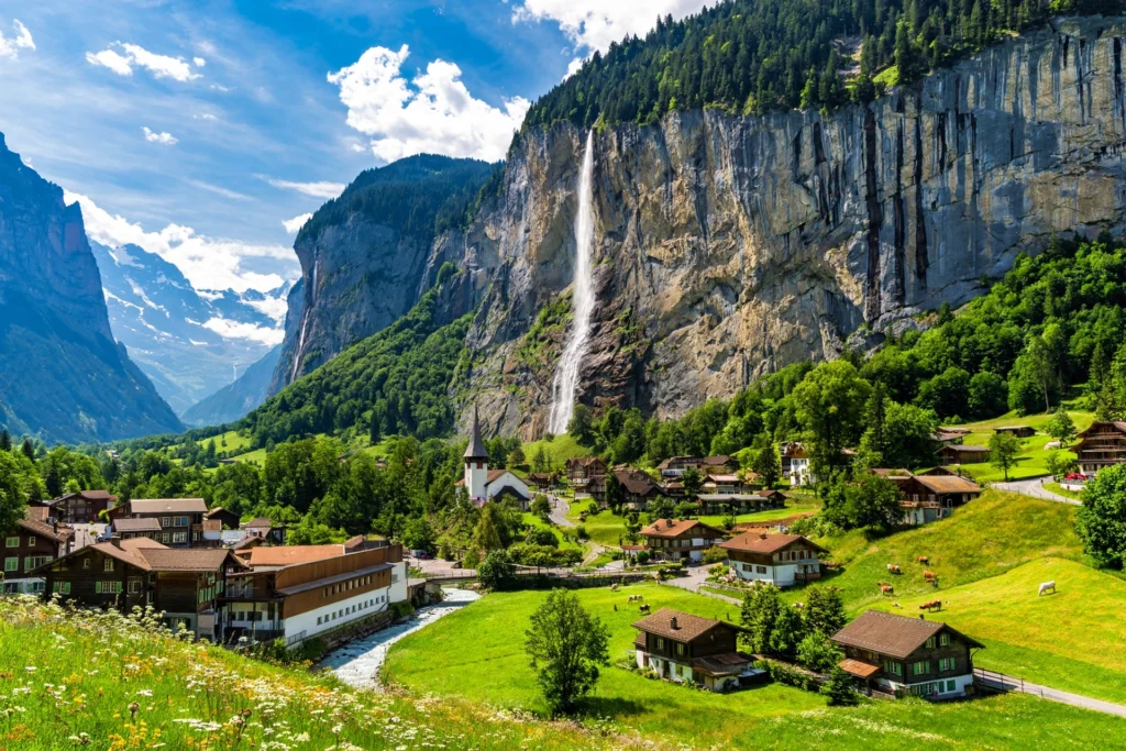 Staubbach Falls dropping from cliffs in Lauterbrunnen Valley, Switzerland.
