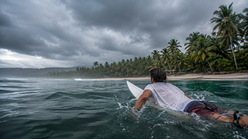 Best Time to Visit Panama: Month-by-Month Guide 1 Surfer entering the water during Panama's best surfing season