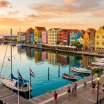 Colorful Willemstad waterfront buildings illustrating whether Curacao is expensive to visit