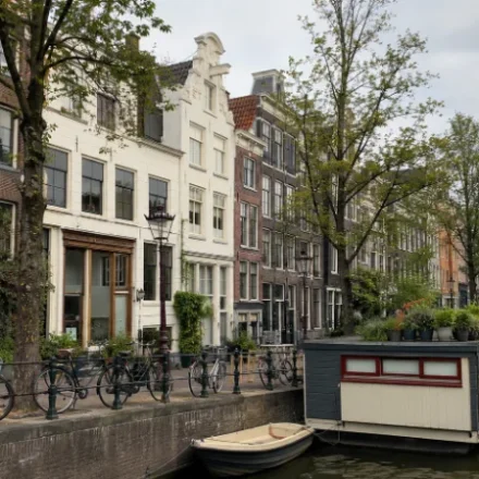 Amsterdam Travel Guide for First-Time Visitors 54 Amsterdam travel view of canal houses and parked bikes
