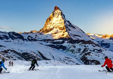 Skiers below the Matterhorn at one of the best places to go skiing in the Alps.