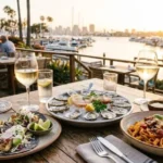 Patio table with tacos, oysters and pasta showing the best places to eat in San Diego